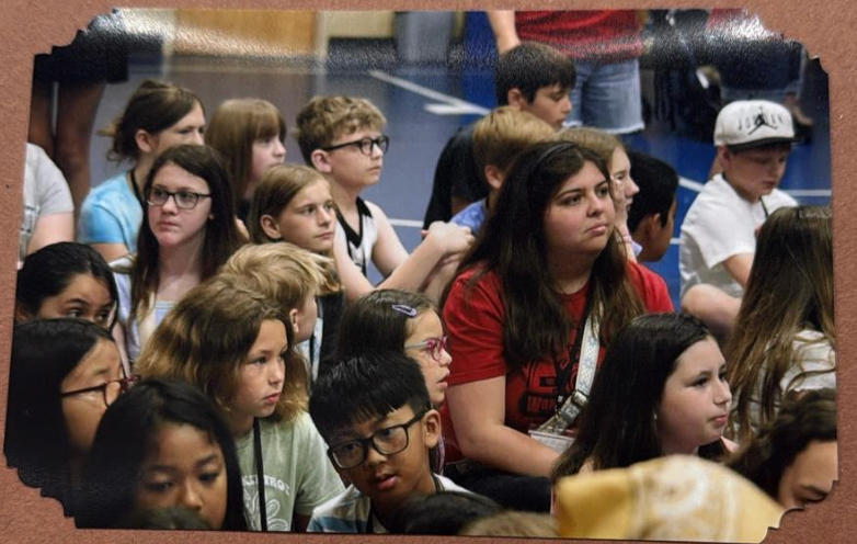 Juliana sitting with the kids at VBS