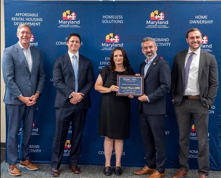 Photo: Melissa Bolyard, Garrett County Business Development's Agriculture Business Specialist accepts a NourishMD grant award from the MD Department of Housing and Community Development.