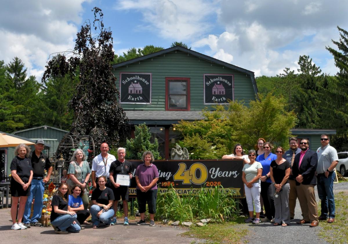 Photo: Schoolhouse Earth is presented with a 40th anniversary proclamation by the Garrett County Commissioners.