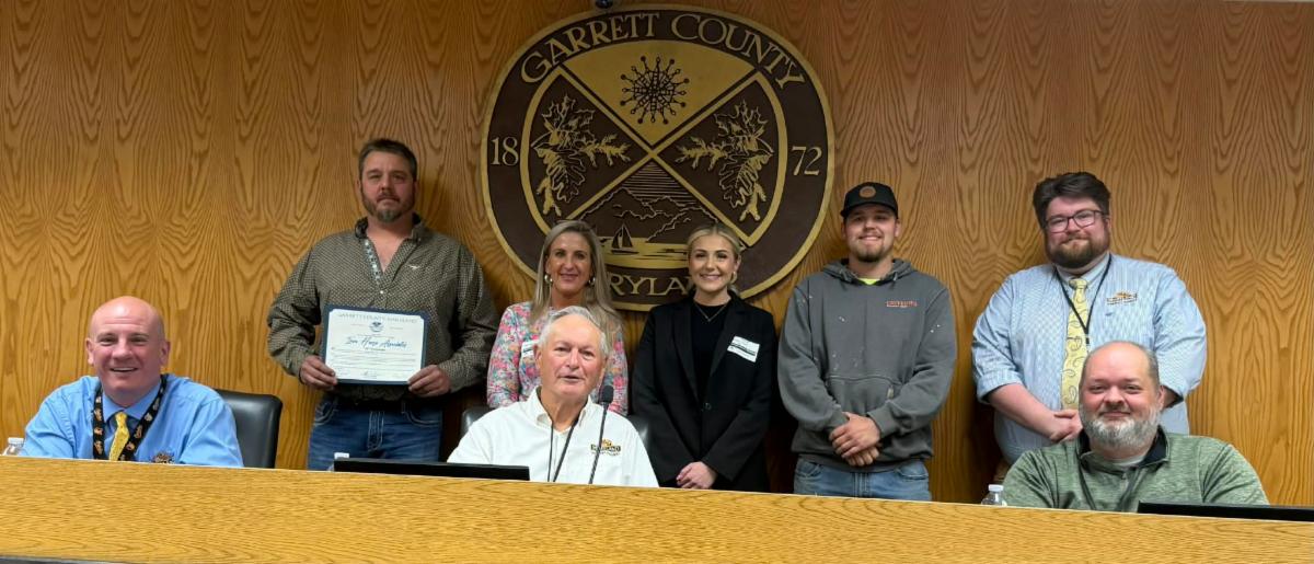 Photo: Front Row (l-r): Garrett County Commissioners Paul Edwards, Larry Tichnell, and Connor Norman. Back Row (l-r): Jeff Thomas, Denise Thomas, Quinn Thomas, and Alden Layman of Iron Horse Associates, and Business Development Specialist Connor Norman. 
