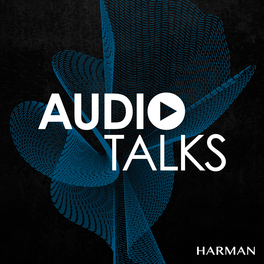 A blue and white logo for the Audio Talks Podcast