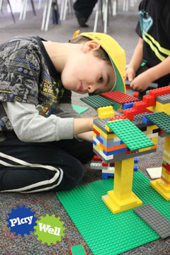 child playing with LEGOs