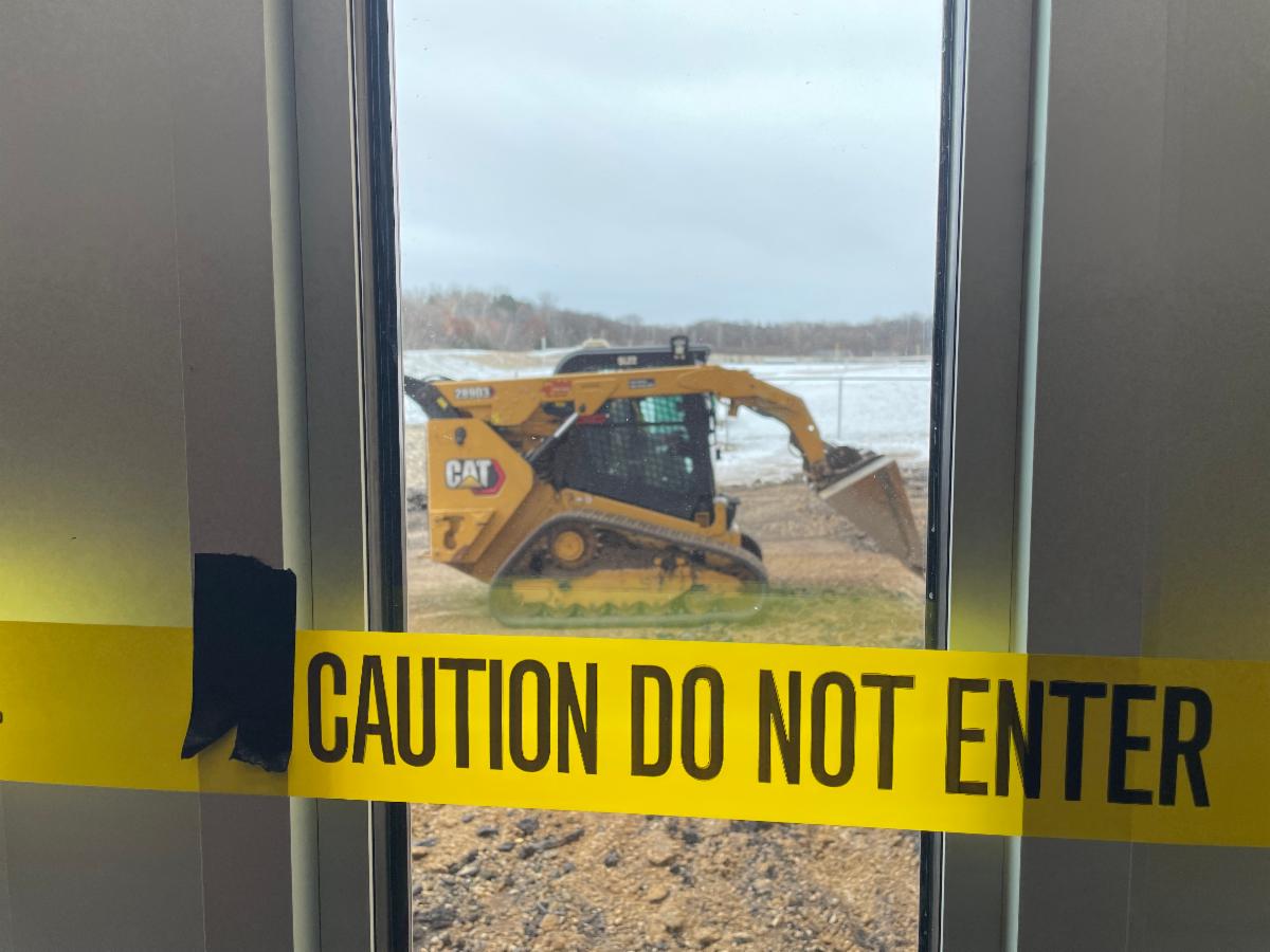 Caution sign with bulldozer
