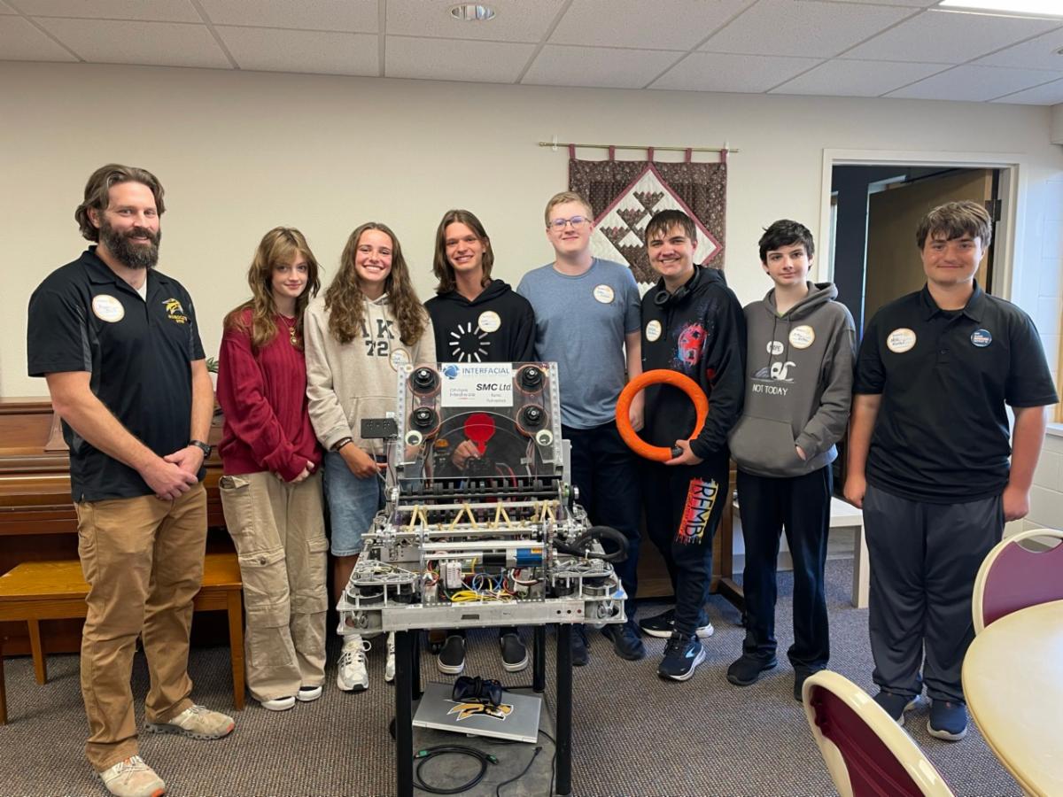 Robotics club students with robot