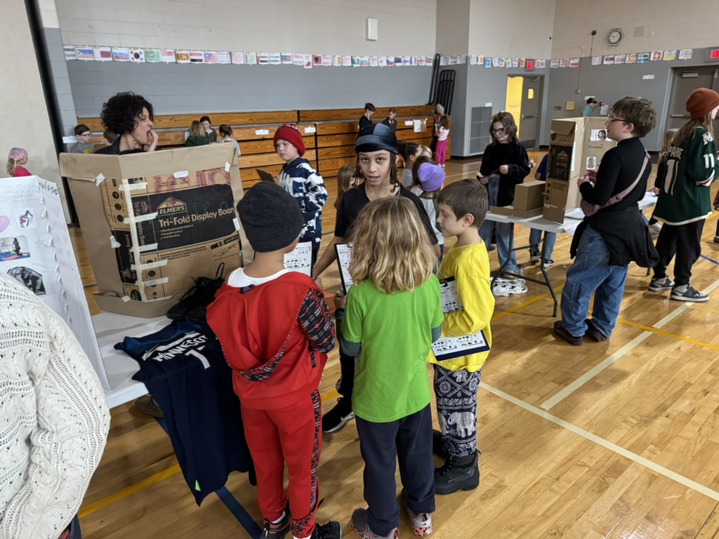 elementary students with their career fair display