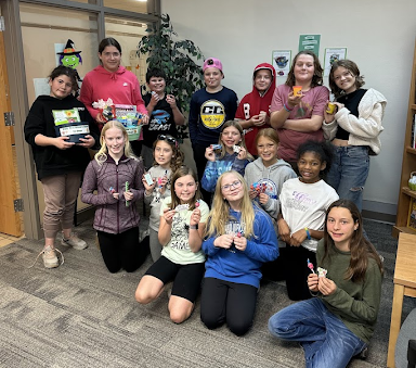 students holding prize baskets