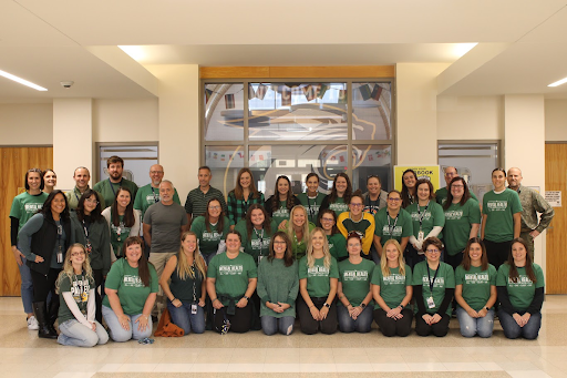 teaching staff wearing green shirts