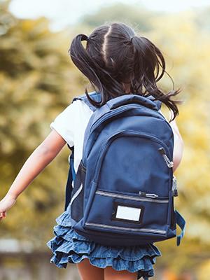 child with backpack