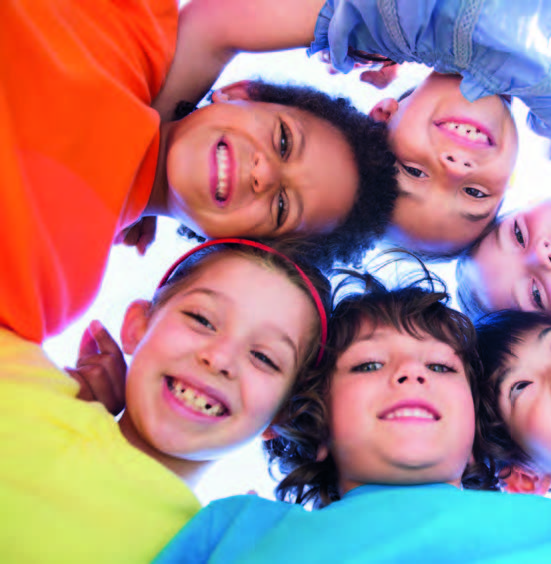 kids in a circle smiling