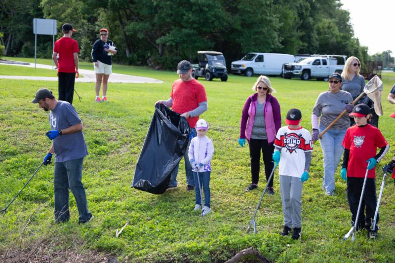 Volunteers performing trash pickup