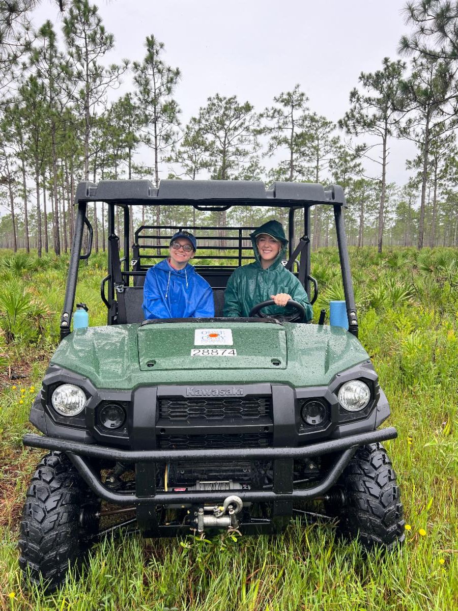 Intern riding in gator