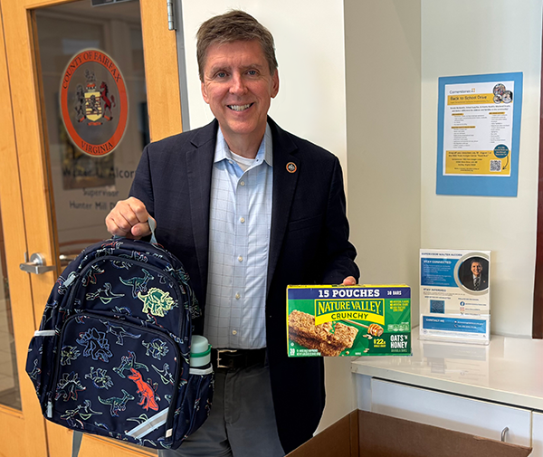 Supervisor Walter Alcorn donating to the Cornerstones Back to School drive