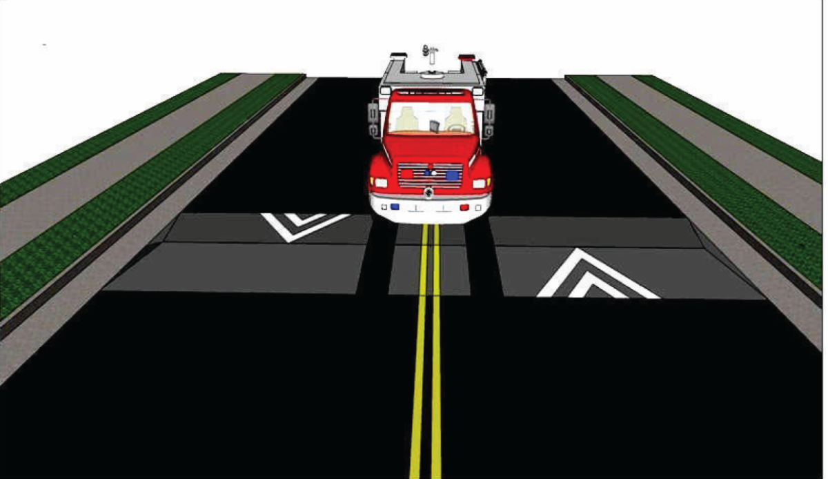 Fire truck passing through a cut-out on a speed hump