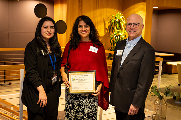 Trace the Zero Waste Store owner receiving a recognition certificate for participating in the Green Business Partner  impact tracking pilot