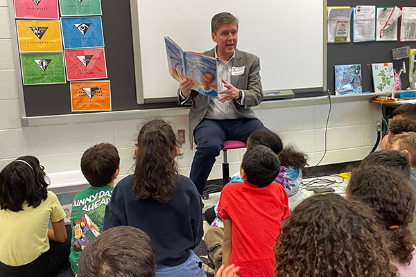 Fairfax County Supervisor Walter Alcorn reading to kids at Aldrin Elementary School on Read Across America Day 2026