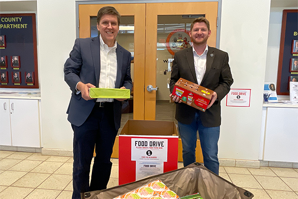 Fairfax County School Board Member Kyle McDaniel donating food for Food for Neighbors food drive March 2025