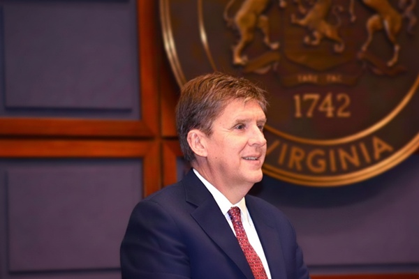 Fairfax County Supervisor Walter Alcorn at dais