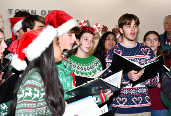 High schoolers singing at the Vienna Holiday Reception