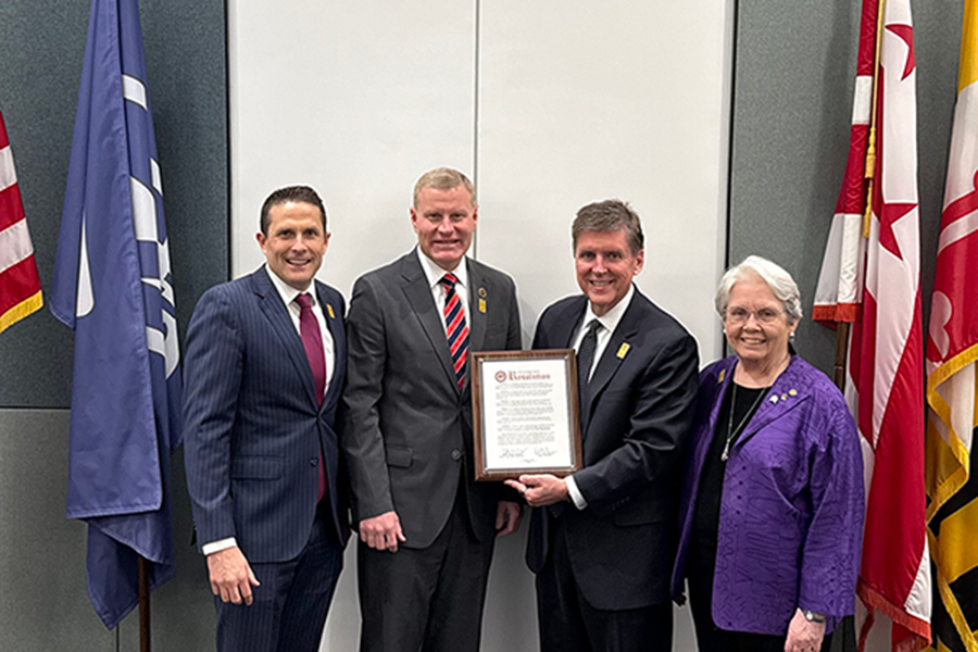 Fairfax  County Supervisor Walter Alcorn presenting a proclamation for Metrorial's 50th aniversary.