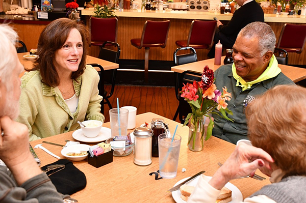 Vienna Mayor Linda Colbert at restaurant table with other people