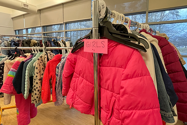 Kids coats hanging on a rack