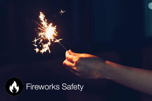 A sparkler with fireworks safety tips