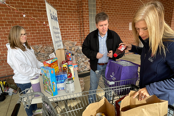 Fairfax County Supervisor Walter Alcorn helping at the Stuff the Bus food drive.