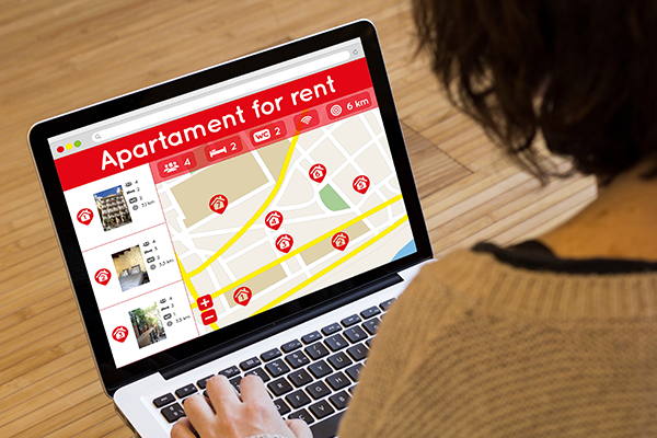 Woman searching for apartments online