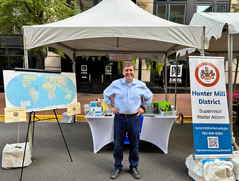 Fairfax County Supervisor Walter Alcorn at his booth at the 2025 Reston Multicultural Festival