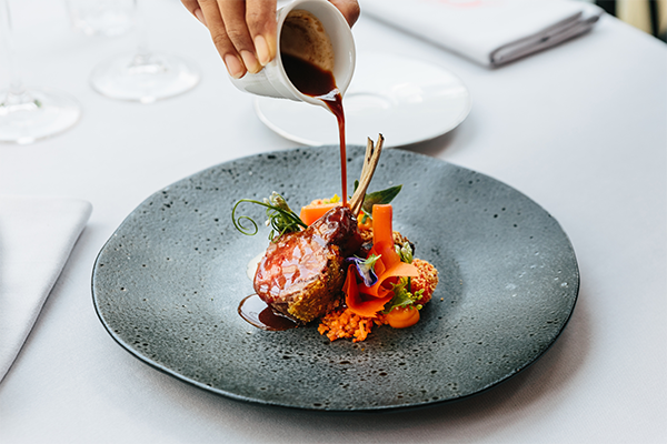 Steak being served on a plate