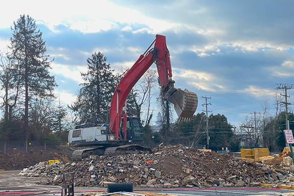 Excavator on a debris pile of the demolished Patrick Henry Library