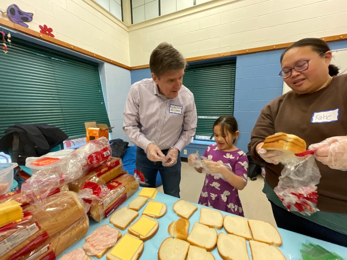 Walter making sandwiches at the 2025 MLK event at Cathy Hudgins Community Center