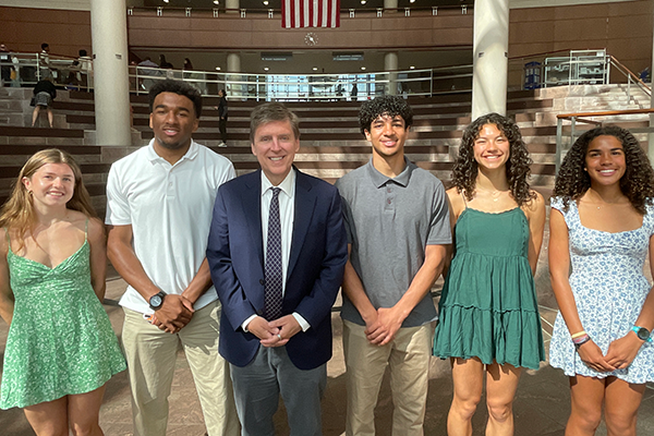 Fairfax County Supervisor Walter Alcorn with South Lakes High School state track champions for the 2025-2026 winter sports season