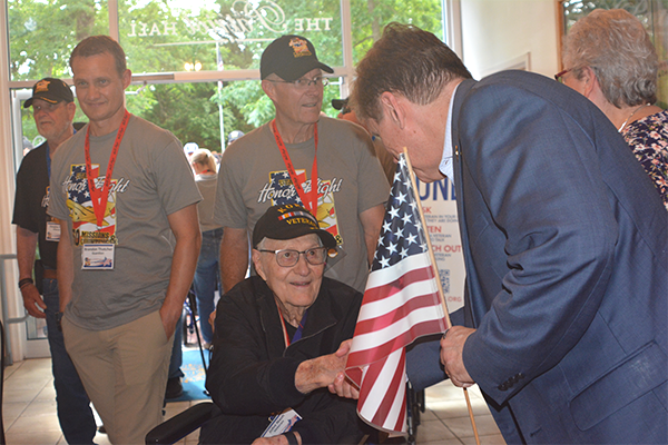Fairfax County Supervisor Walter Alcorn greeting an honor flight veteran