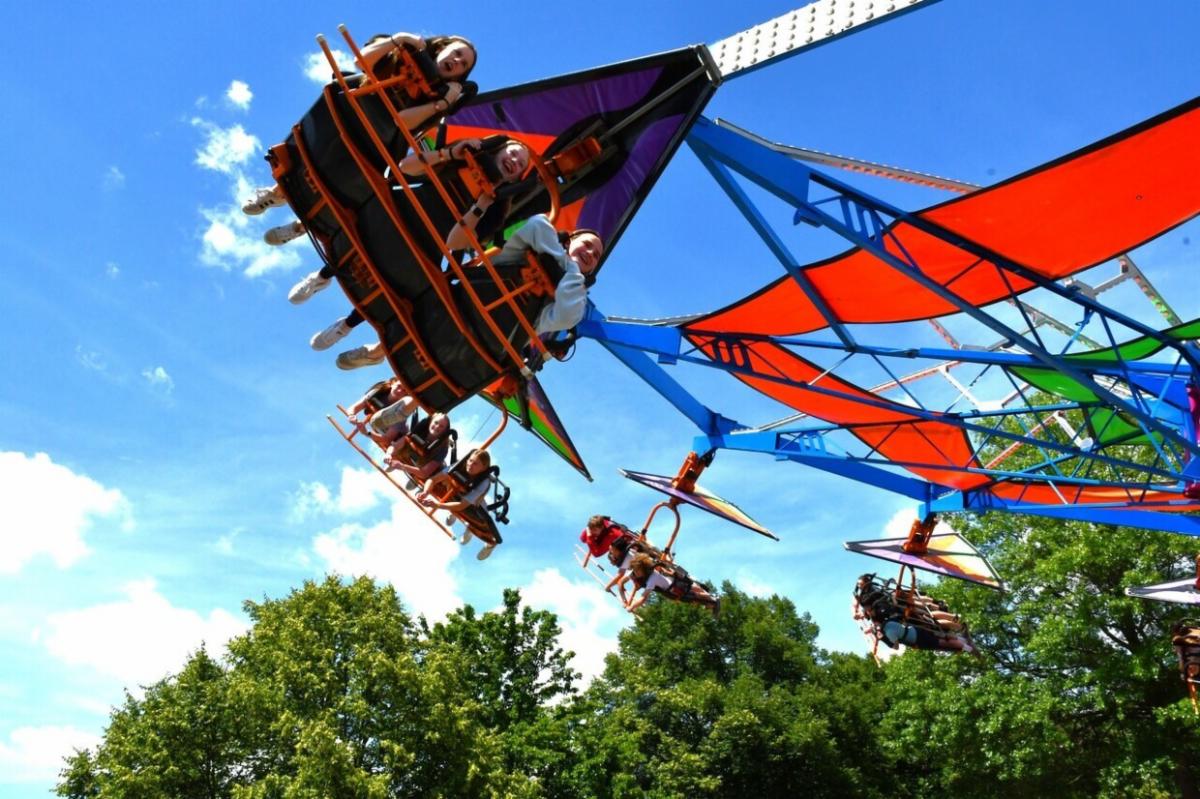 Kids on an amusement ride at ViVa Vienna