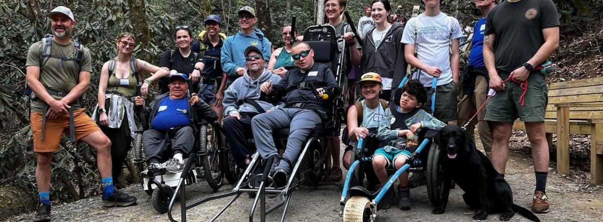 group of people outside smiling for the camera