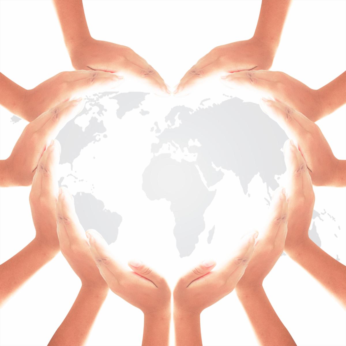 Human hands in hearth shape on white world map of clouds background