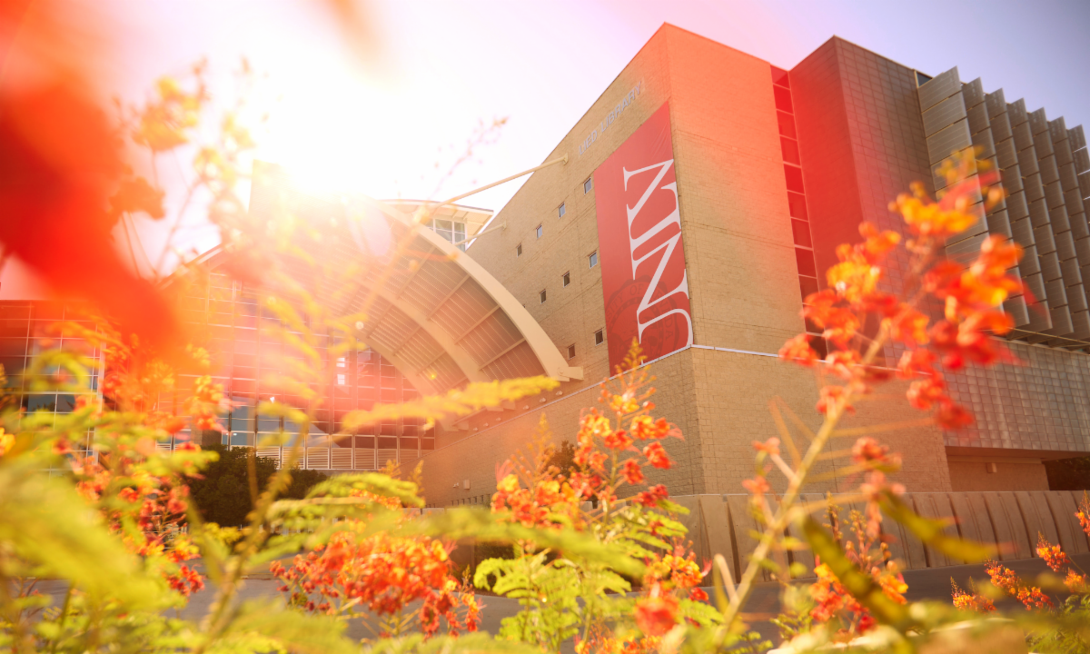 Lied Library with bright sun through greenery
