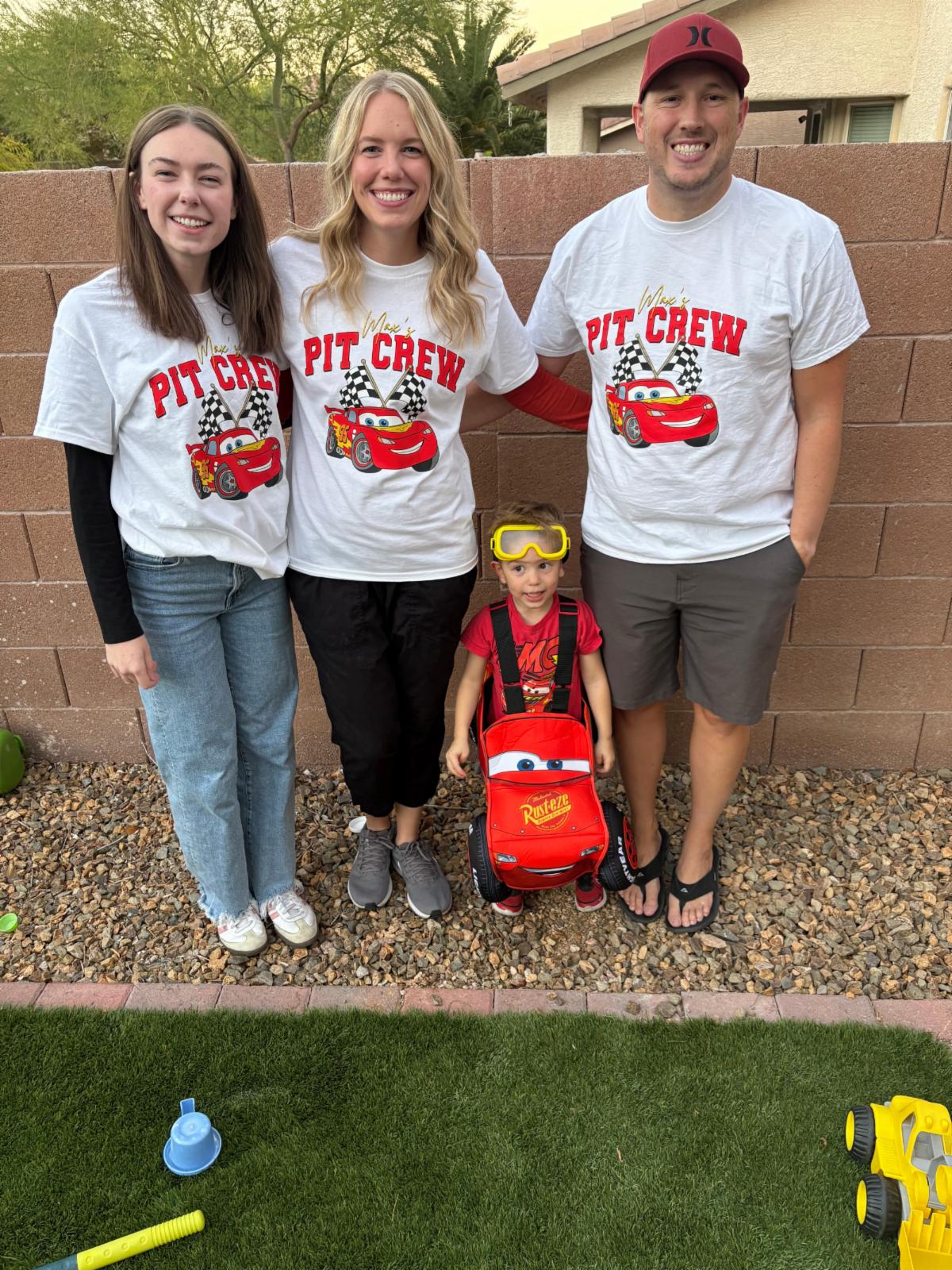 Karlie Passey and family dressed as Lightning McQueen and pit crew