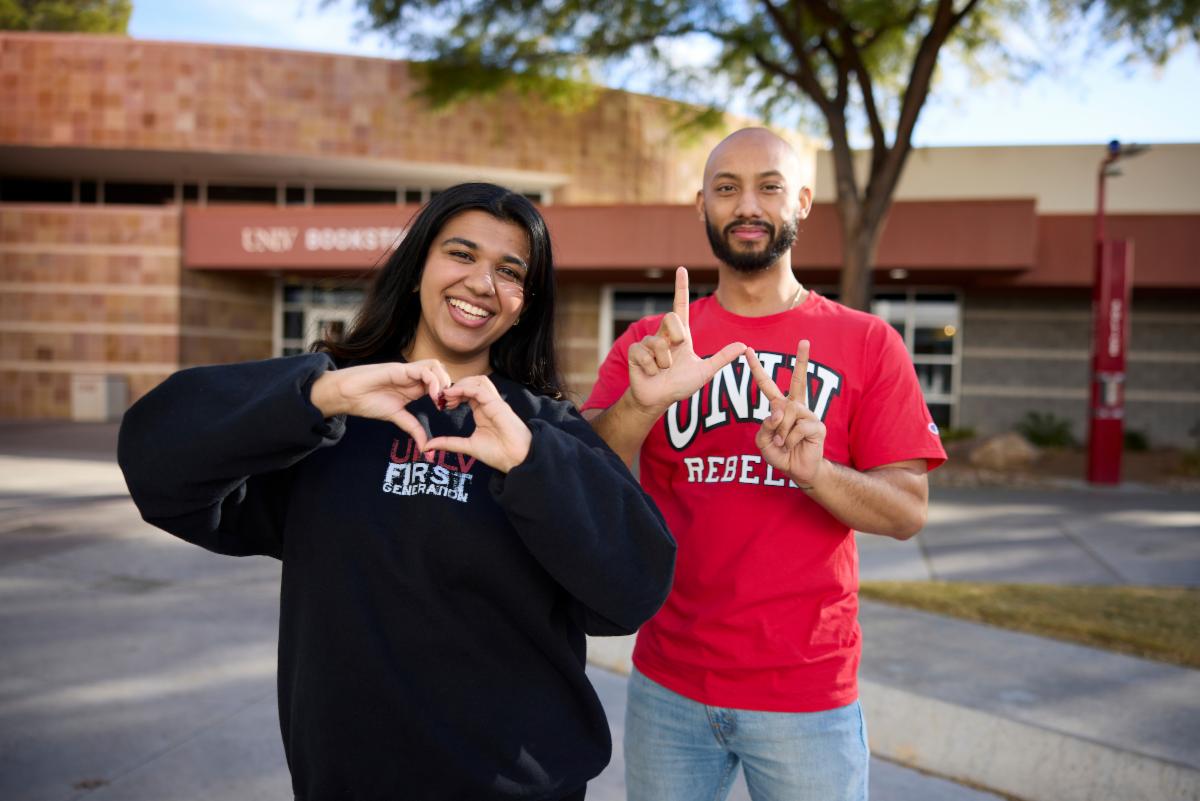 Two people smiling and showing appreciation towards each other. 