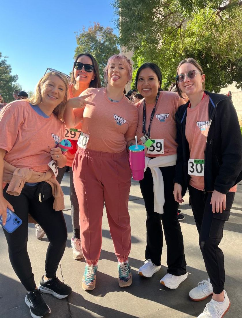 A group of Business Affairs employees pose at the Turkey Trot