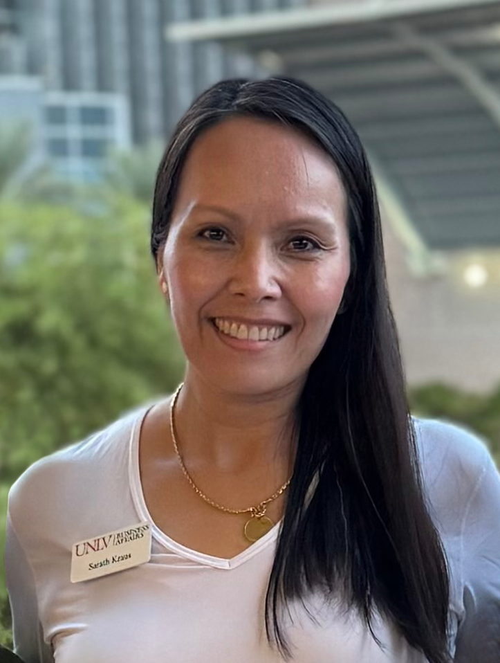 Sarath Kraus' headshot in front of Lied Library