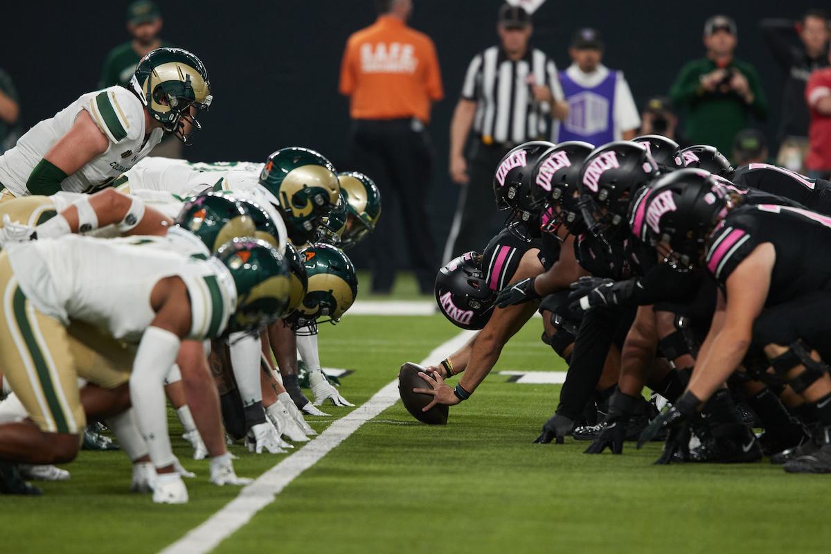 UNLV football players face off against a rival team during the homecoming game