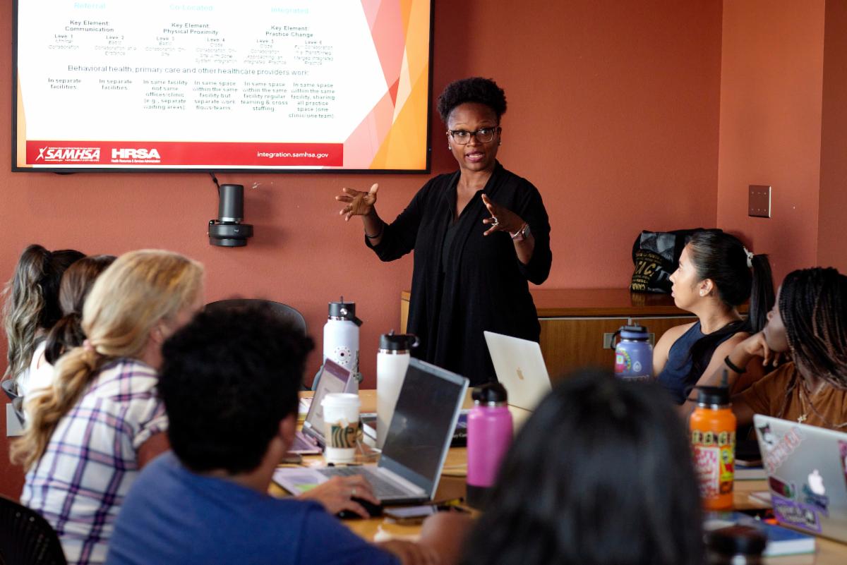 Visiting lecturer Natasha Mosby instructs a class of adult learners