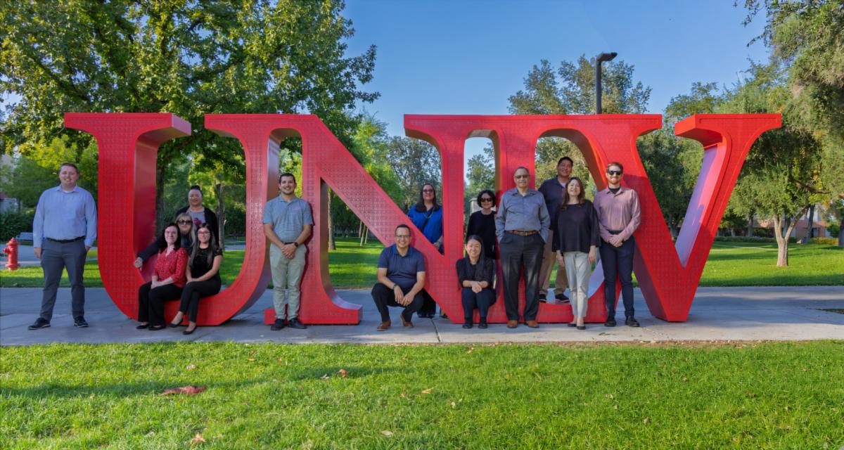 Accounting Team in front of UNLV letters