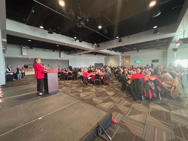 Interim Business Affairs Vice President, CFO speaking to the Business Affairs holiday crowd. 