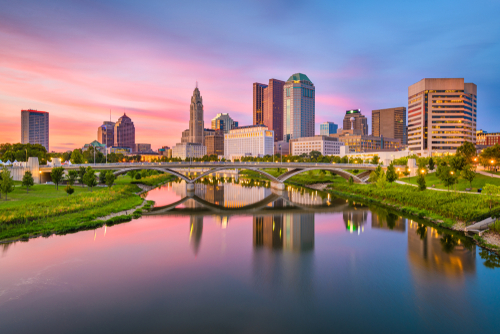 Columbus_ Ohio_ USA skyline on the river at dusk.
