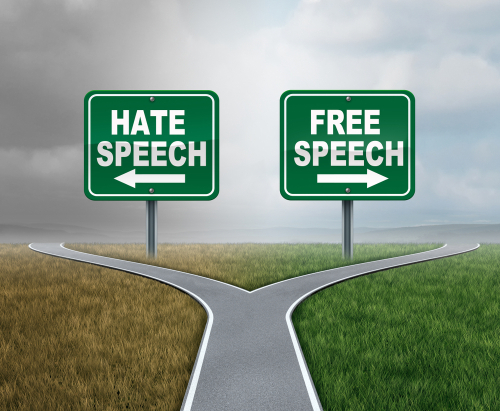 Free speech and hate talk as freedom or hatred symbol as opposite political directions with 3D illustration elements.