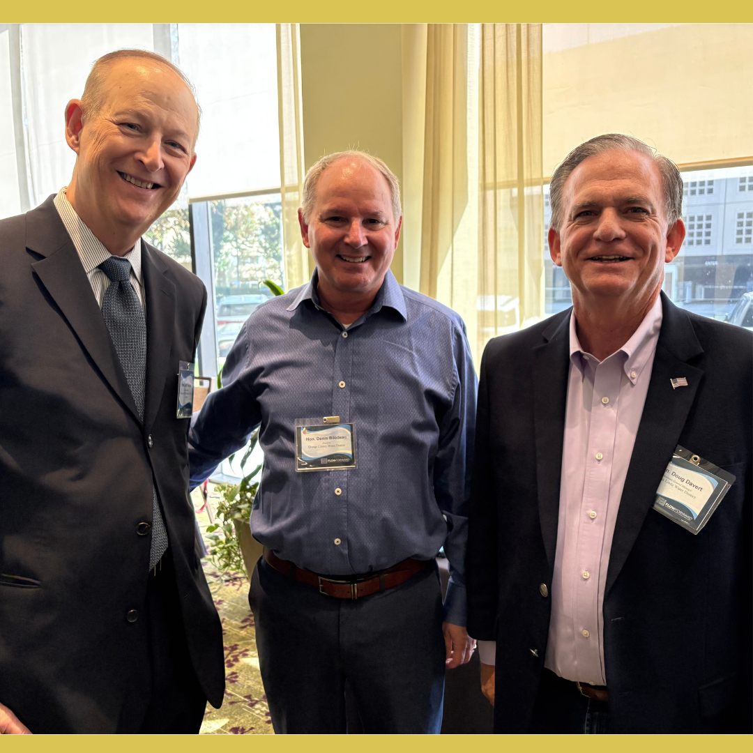 Picture from the OC Water Summit of 3 people attending the event