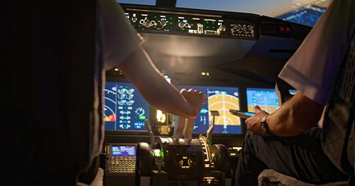pilots in a jet cockpit